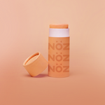 Load image into Gallery viewer, Front view of the orange Noz sunscreen 
